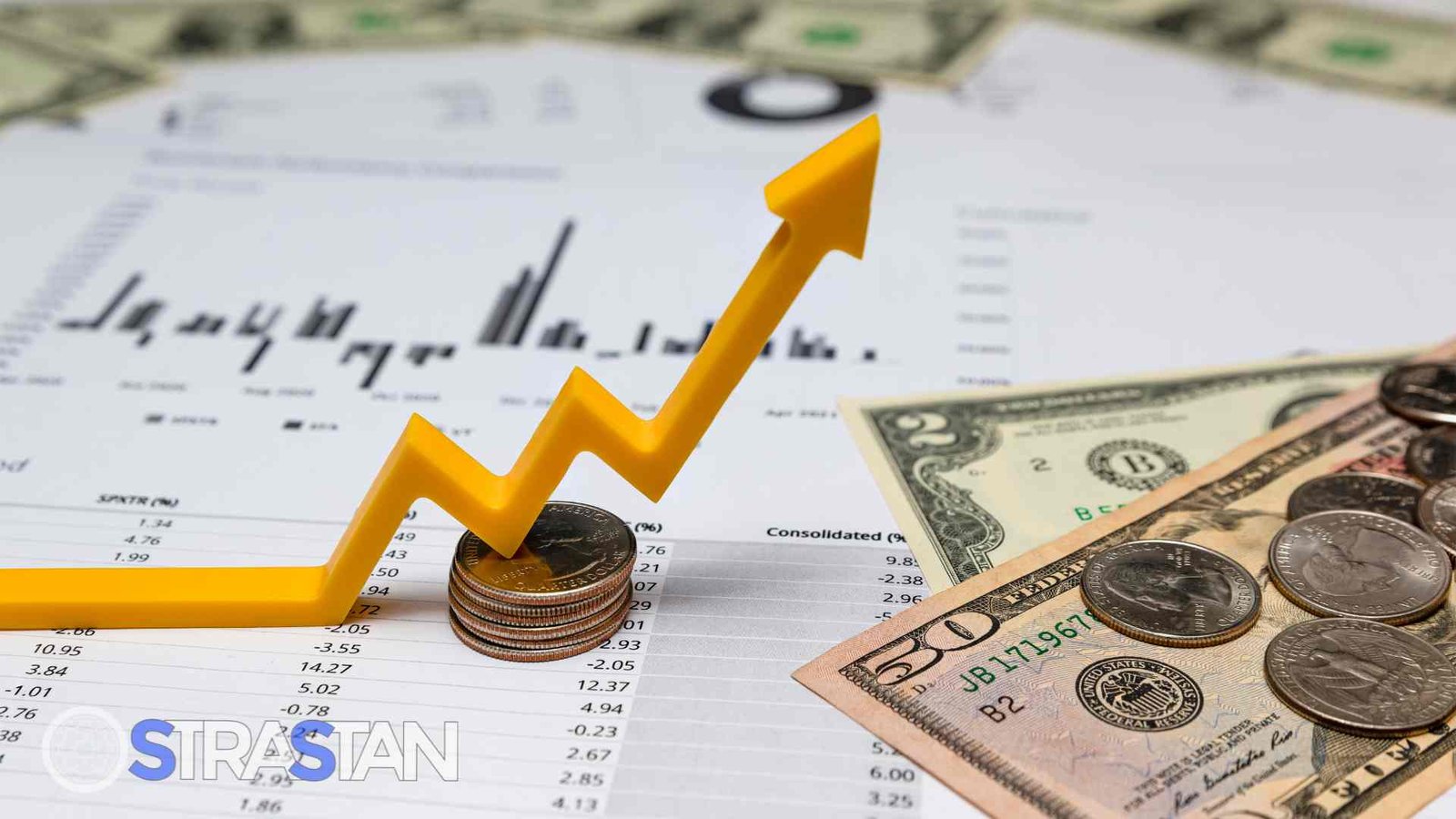 A yellow upward-trending arrow placed on stacks of coins and financial documents, signifying increased profits and excellent app ROI.