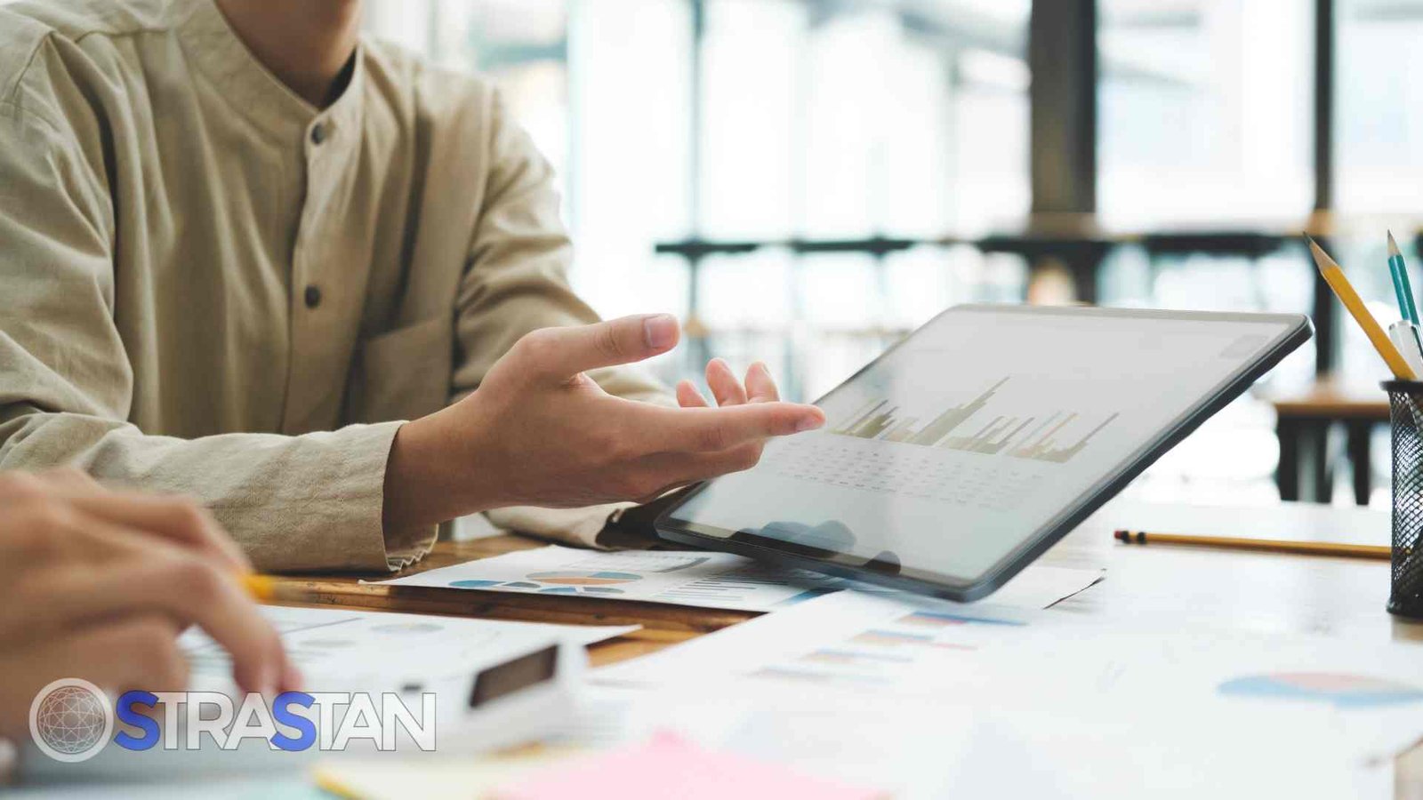 A developer working on a laptop, which displays a website's technology page, representing website development as one of the key SME solutions.