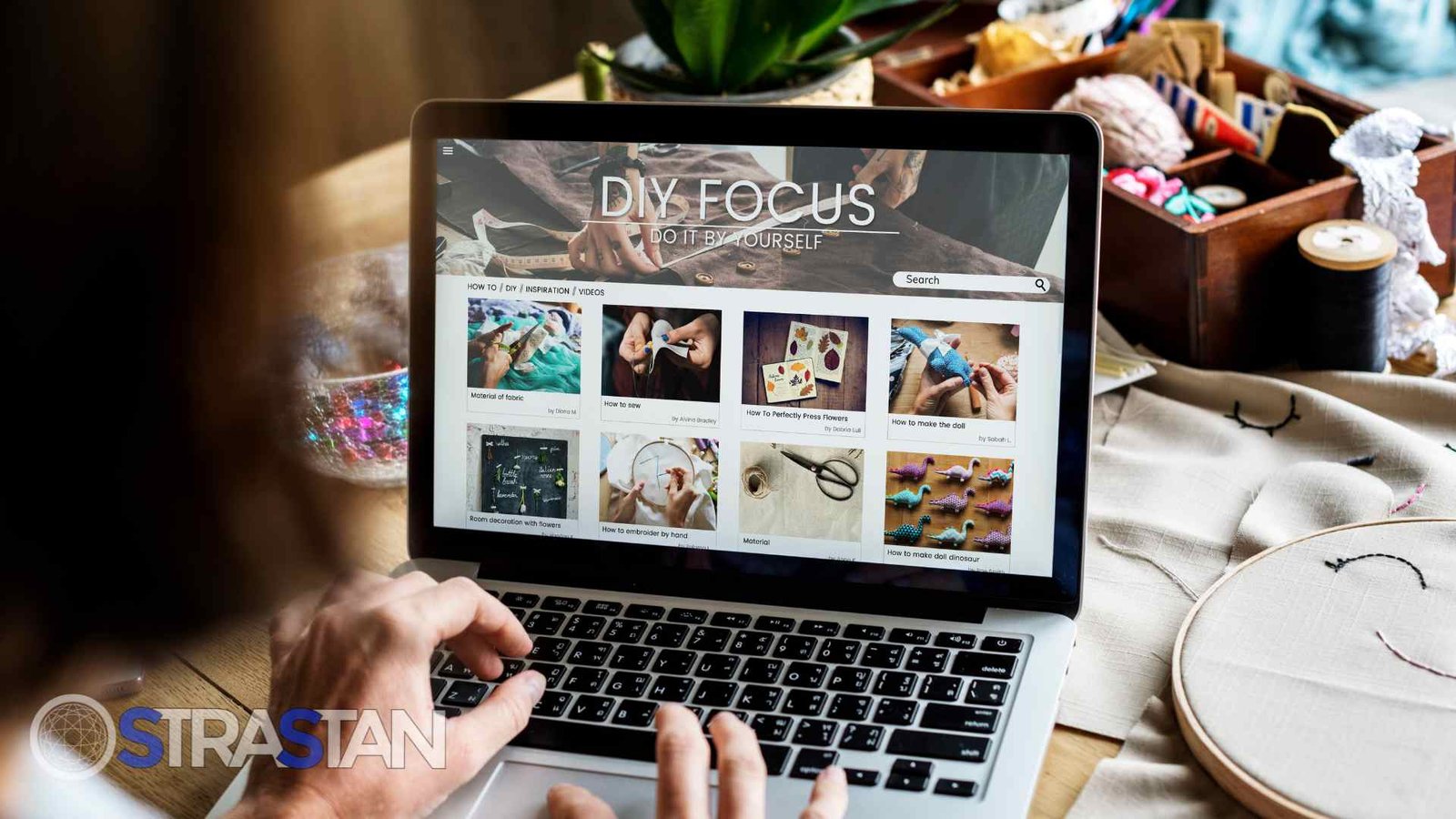  A person browsing DIY craft videos on a laptop displaying "DIY FOCUS - DO IT BY YOURSELF," providing a clear visual for Tech Comparisons